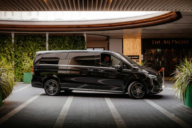 A black Mercedes V-Class outside a London hotel