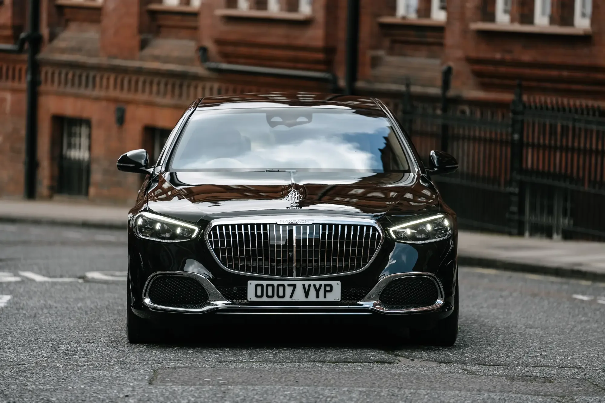 Front view of a black Mercedes-Maybach on a London street