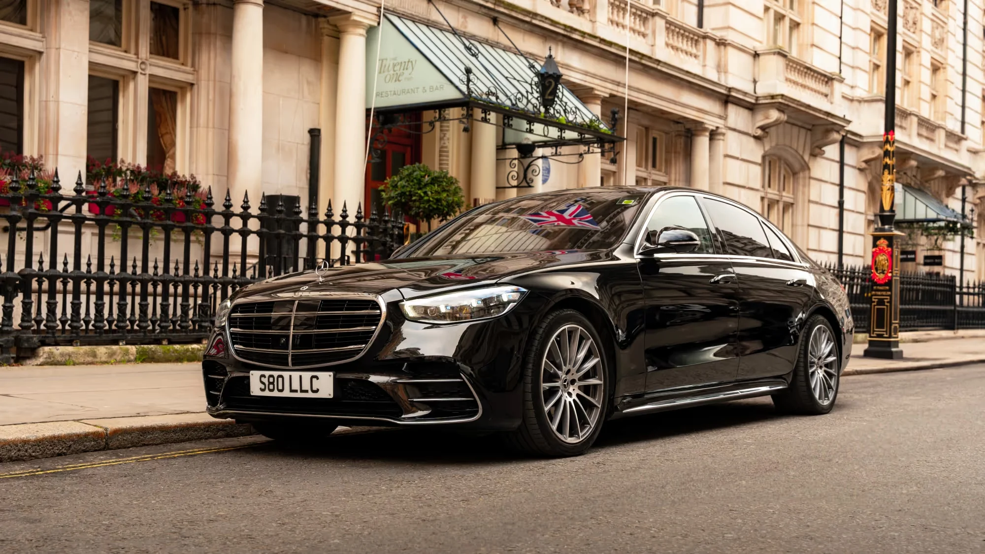 Black Mercedes-Benz S-Class outside a London hotel