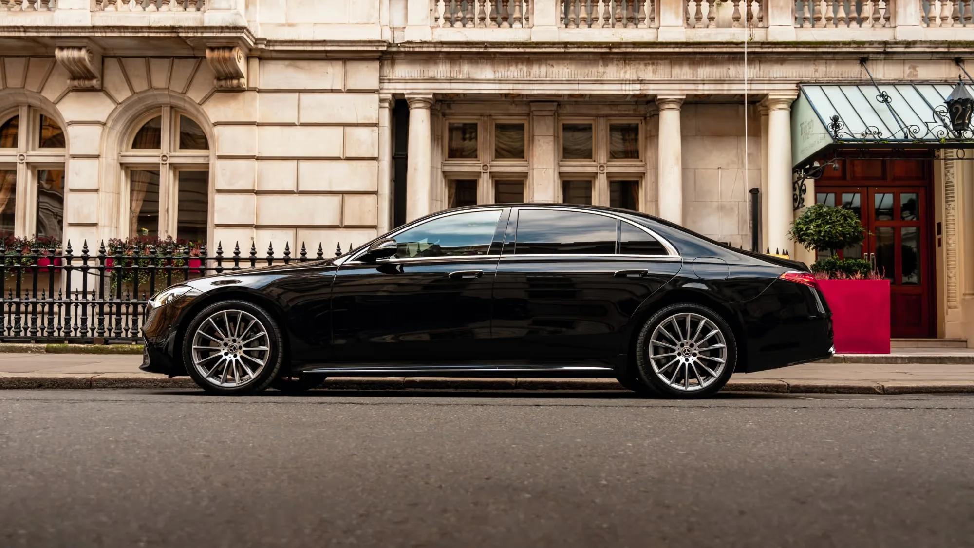Side profile of a black Mercedes-Benz S-Class in London
