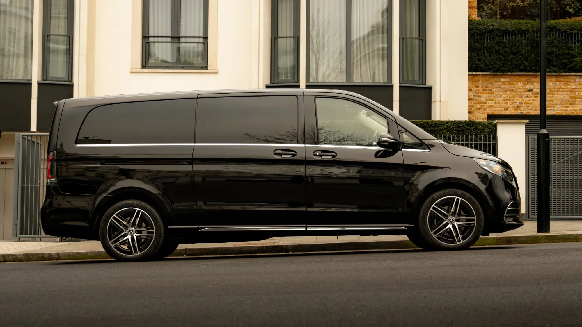 Side profile of a black Mercedes-Benz V-Class in London