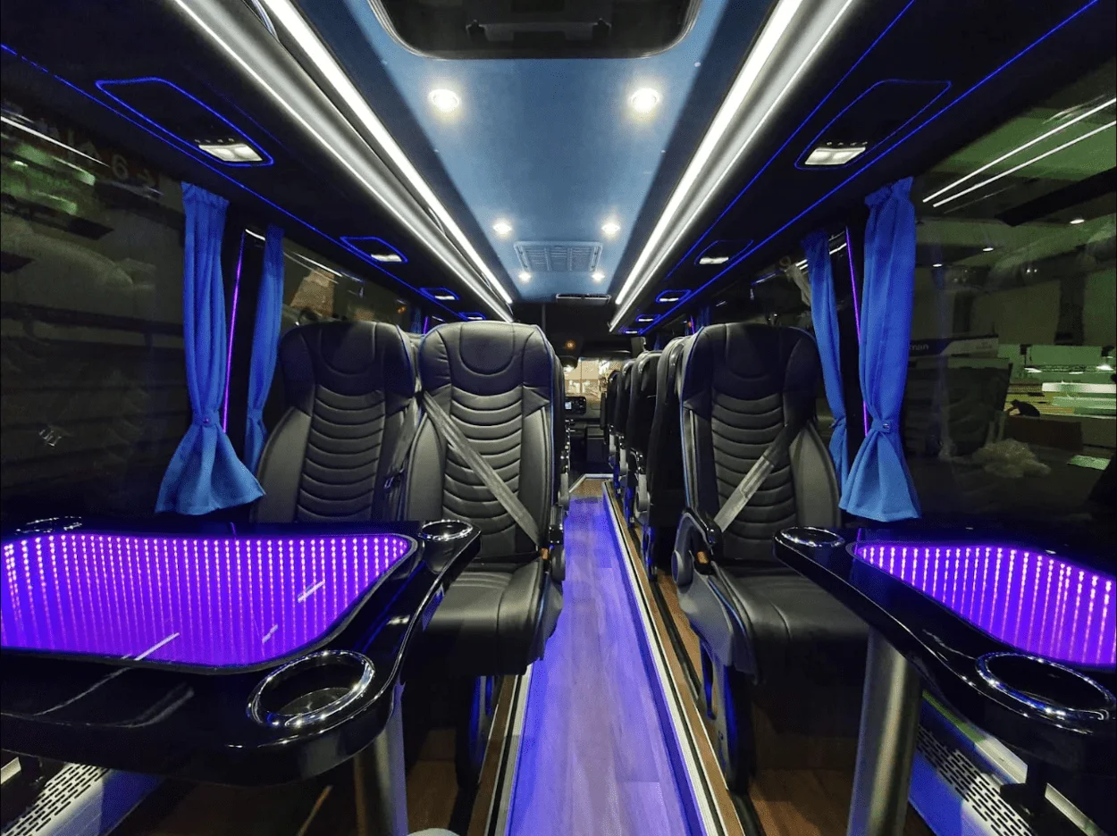 VIP minibus cabin with leather seats and tables